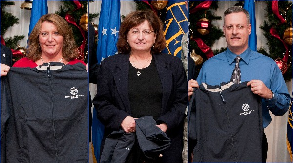 Hanscom Air Force Base Unsung Heroes recognized at the December meeting are (l-r) Sandy Davison, contracting; Donna Bibeau, 66th Air Base Group; and Scott Thibodeau, Battle Management Directorate. Not pictured is Erika Carey.